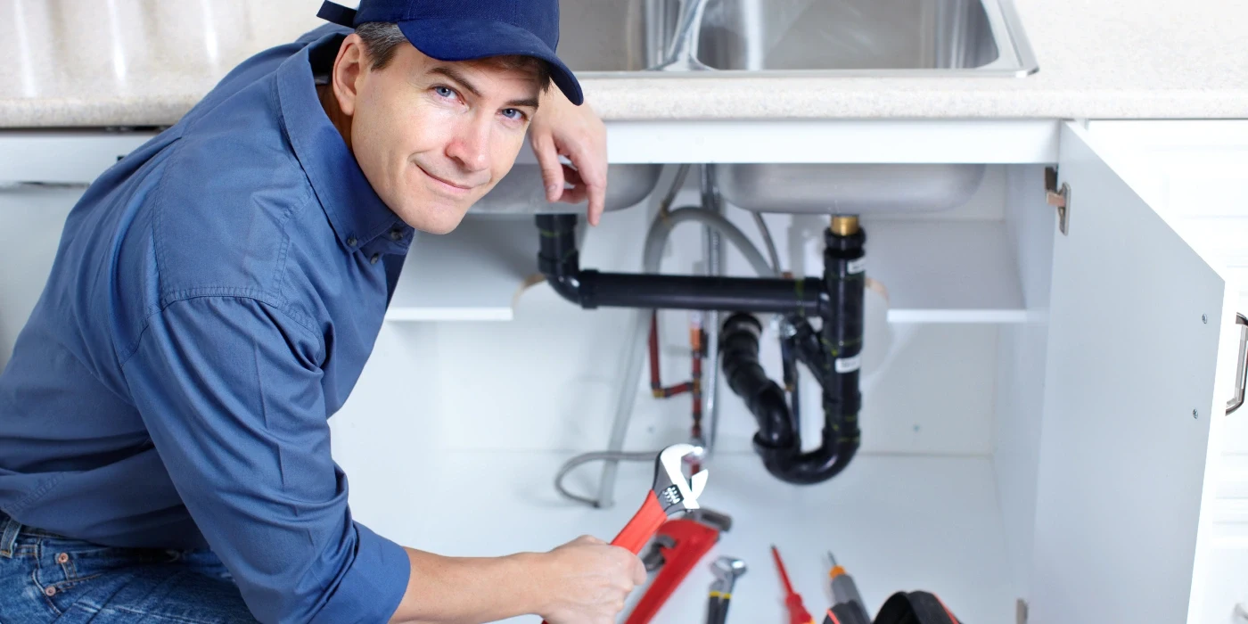 a plumber technician with a tool belt from Plumbing Lake Travis in Cedar Park, TX - Cedar Park TX a plumber technician with a tool belt from Plumbing Lake Travis in Cedar Park, TX - Cedar Park TX