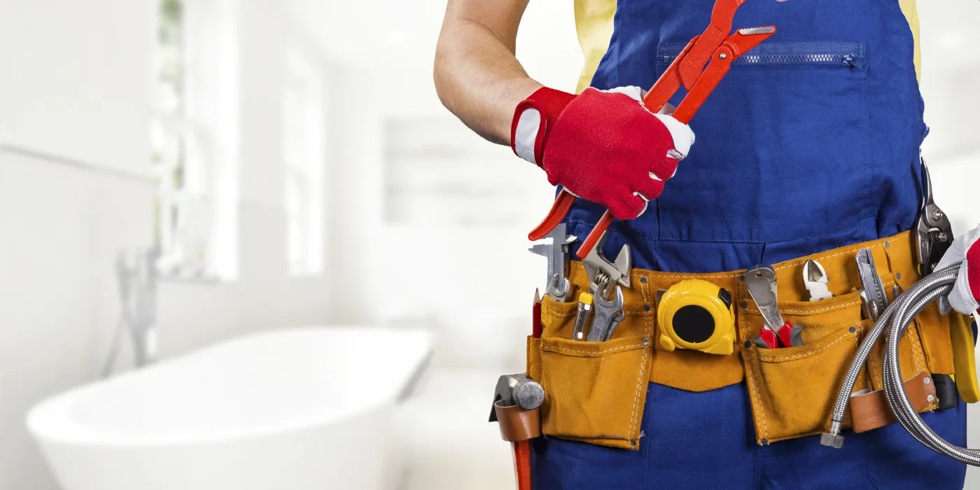 The torso of plumbing technician showing a tool belt from Plumbing Lake Travis in Austin, TX - Commercial plumbing services The torso of plumbing technician showing a tool belt from Plumbing Lake Travis in Austin, TX - Commercial plumbing services