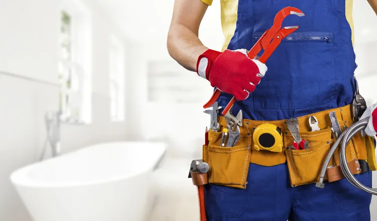 The torso of plumbing technician showing a tool belt from Plumbing Lake Travis in Austin, TX - Septic System Maintenance & Repair